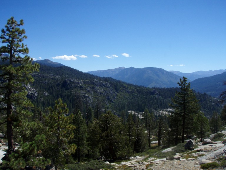 Starting on the left, at the highest point of the rock, we skirted right and down at the pines on the right. Thru the manzanita to the light colored rock on the center right. The back up around the rock on the right to the car.