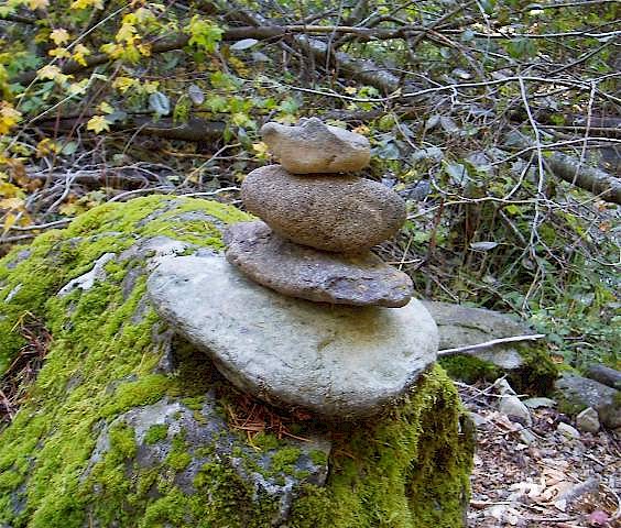 Stones marking a lightly used trail.